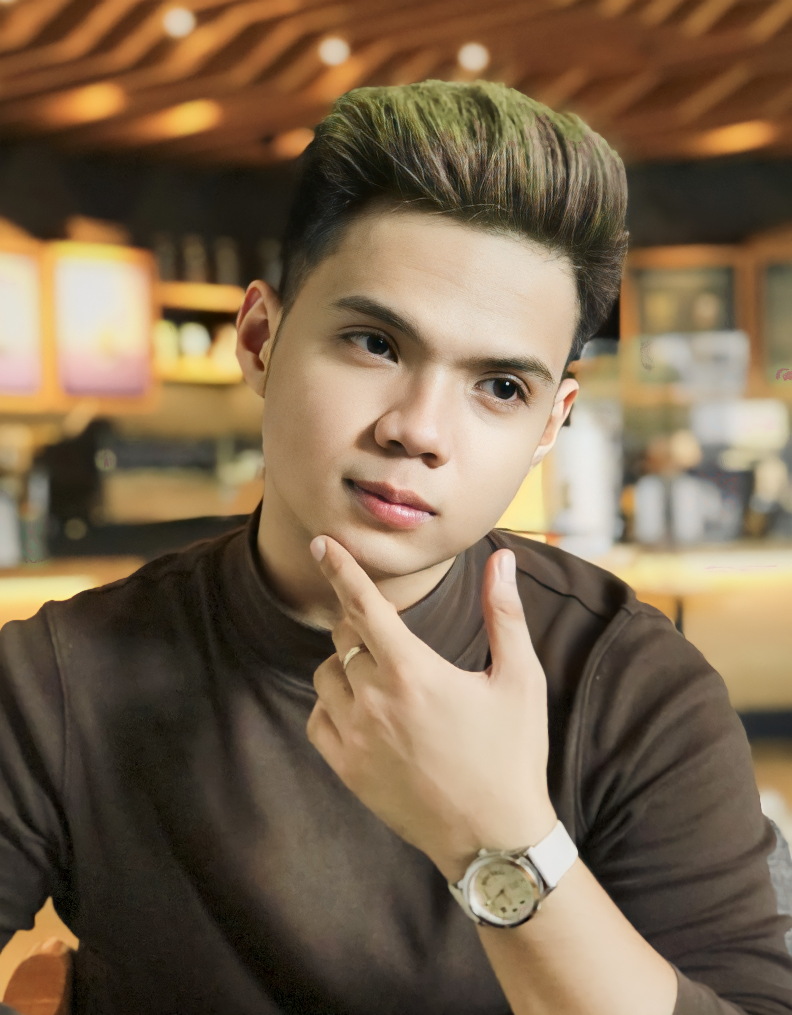 A close-up photo of Vince Cunanan in a coffee shop.