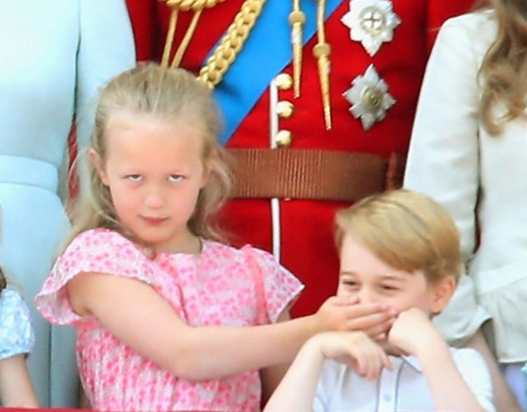 Cousins Savannah Phillips and Prince William share a playful moment during the 2018 Trooping the Colour.