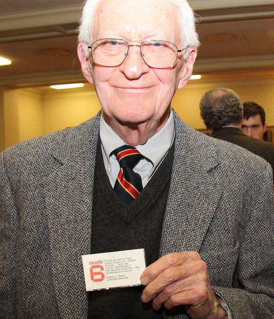 Robert Anders holding the phony business card that was part of the ploy that allowed him to escape from Iran