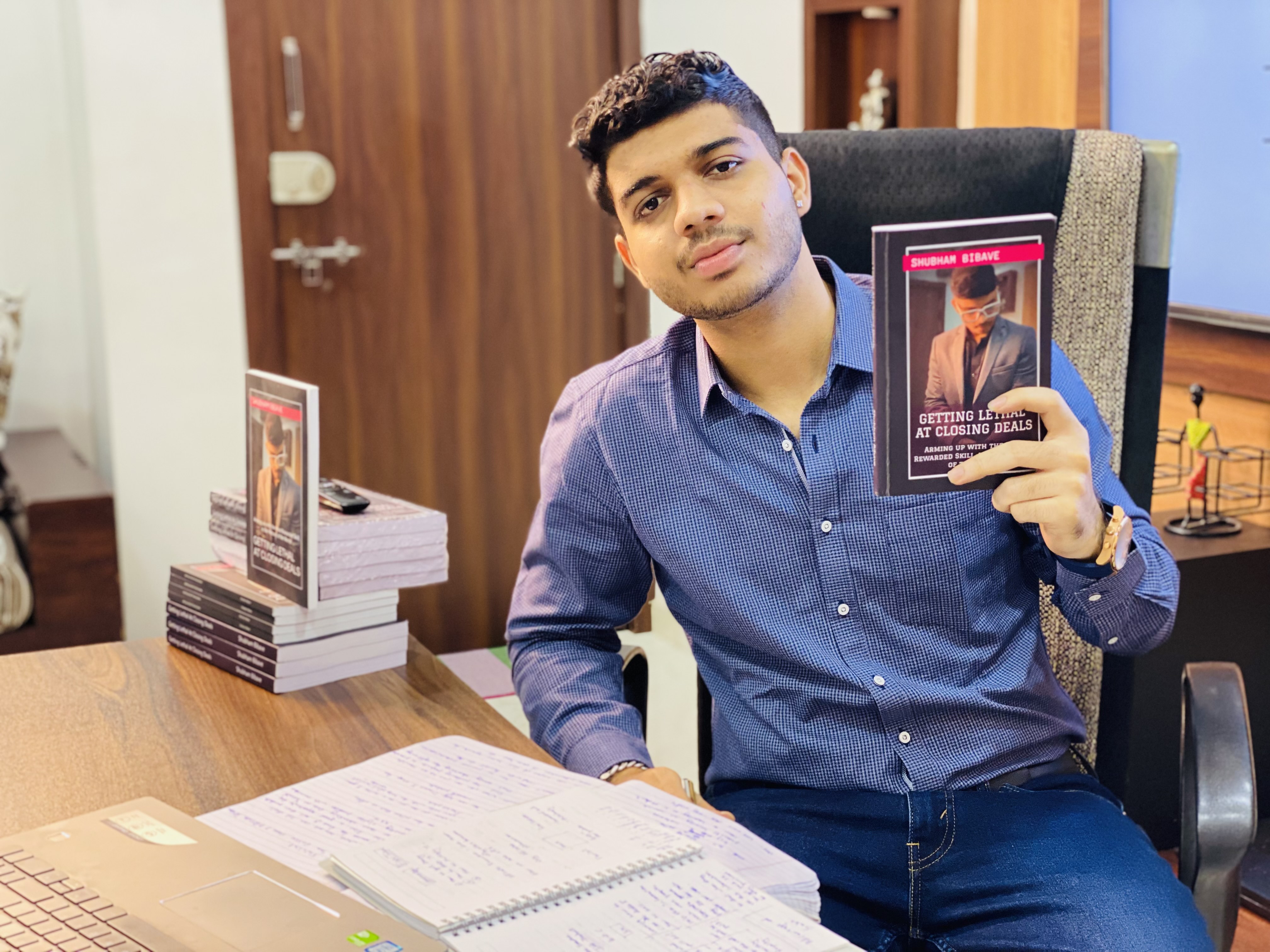 Shubham Bibave with his book 'Getting Lethal At Closing Deals'.