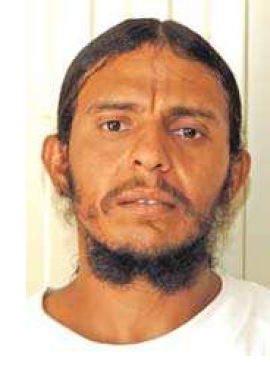 Tolfiq Nassar Ahmed al Bihani's Guantanamo identity portrait, showing him wearing the white uniform issued to compliant captives.
