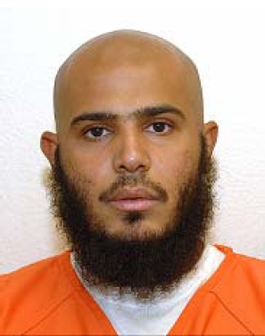 Ghaleb Nasser's Guantanamo identity portrait -- his orange uniform signifies JTF-GTMO considered him a non-compliant captive.