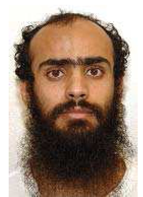 Ali Ahmad Muhammad al-Razihi's Guantanamo identity portrait -- his tan uniform signifies JTF-GTMO considered him a compliant captive.
