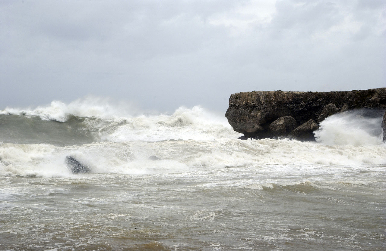 US Navy 050708-N-2903M-002 Waves crash against a 30-foot cliff at Cable Beach located on the southern coastline of Naval Station.jpg