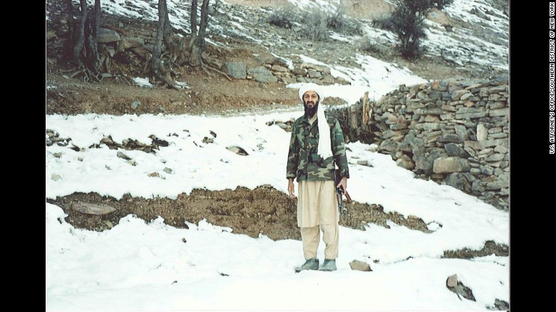 Osama bin Laden holds a Kalashnikov rifle in Tora Bora, a mountainous area of Afghanistan, in November 1996.jpg